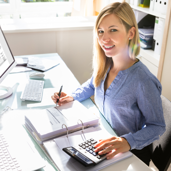 young-businesswoman-calculating-bill-office young-businesswoman-calculating-bill-office